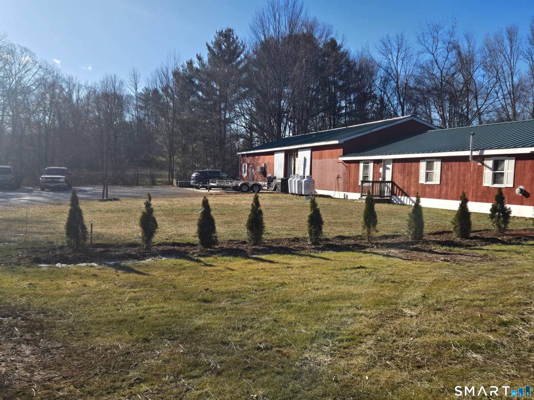 This mixed commercial and residential property features a completely renovated residential unit and a large commercial facility with industrial capability.