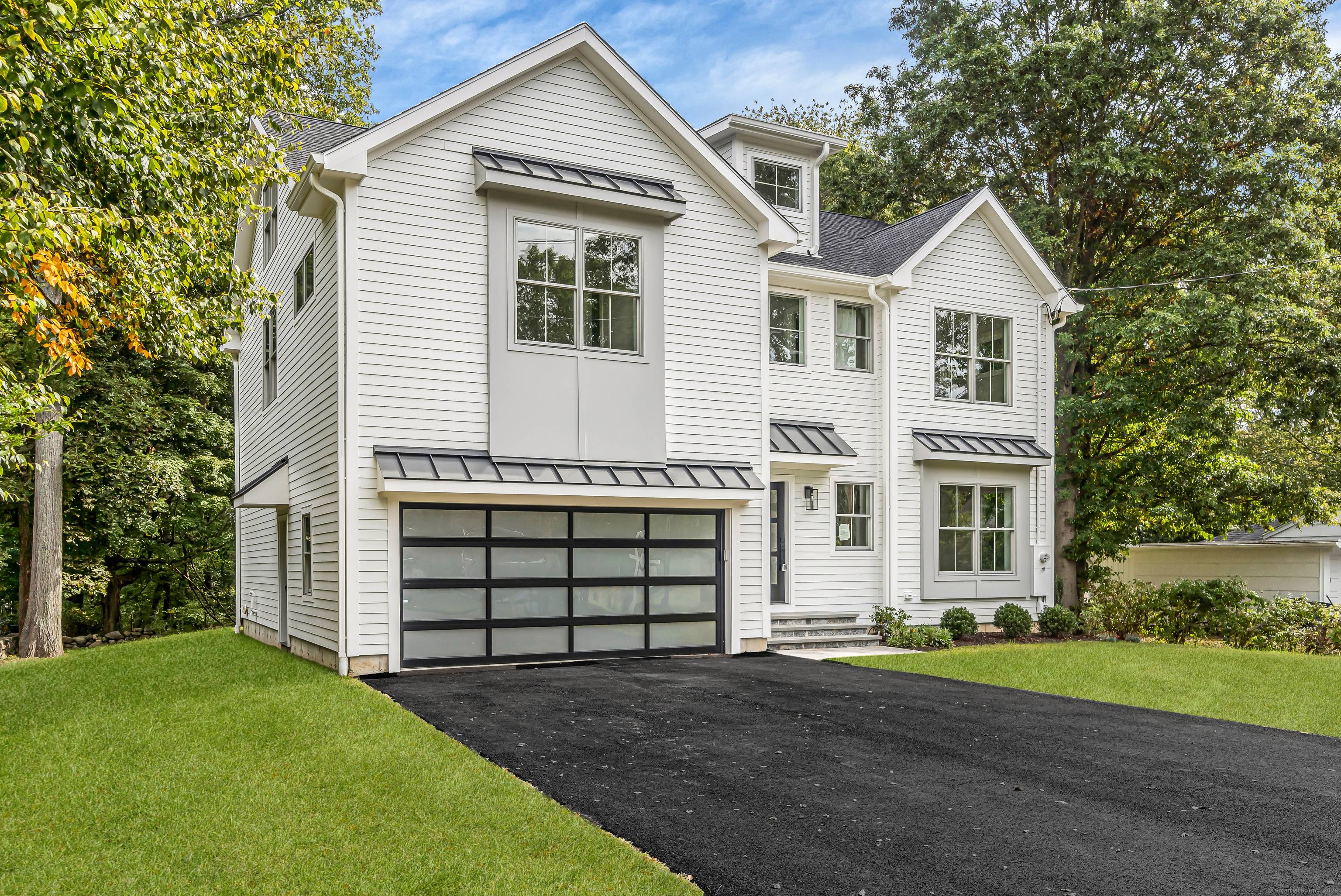 Stunning modern new construction offering high end finishes and sophisticated design throughout.