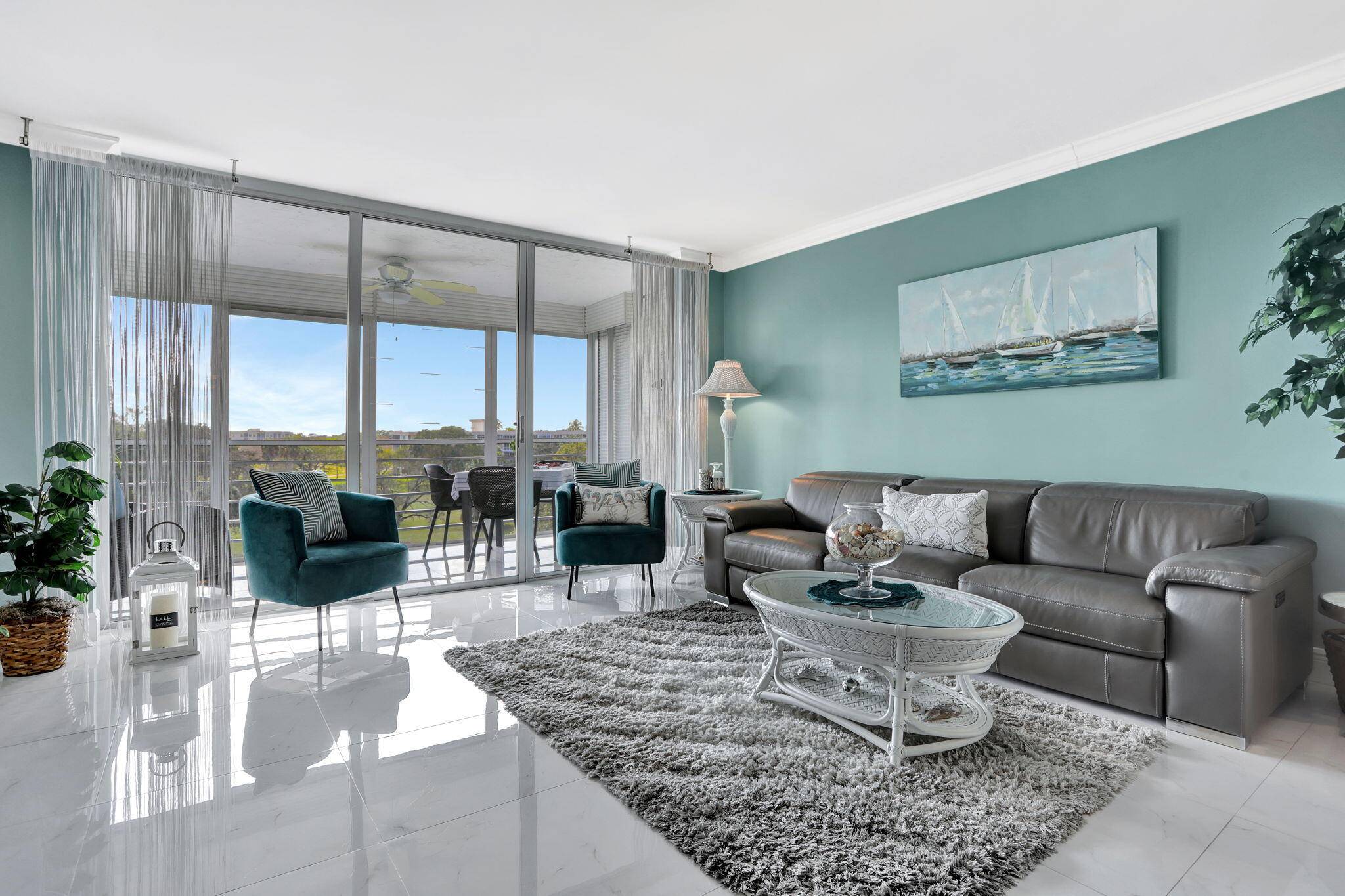 This spacious top floor corner unit is filled with natural light and offers beautiful golf course views from a private balcony.