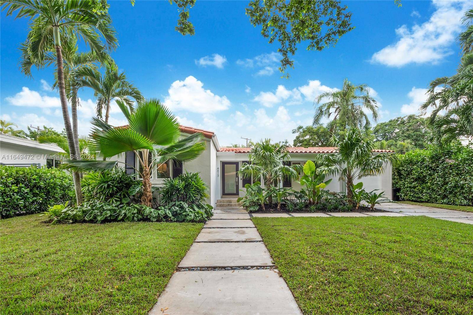 Discover your dream home on San Vicente Street in desirable South Gables !