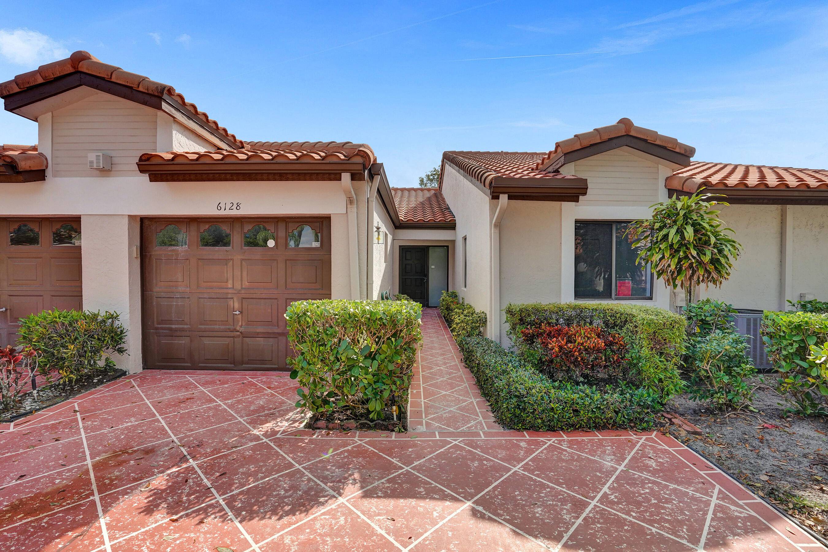 Spectacular make over ! Light, bright 2 2 villa with air conditioned Florida room and attached one car garage.