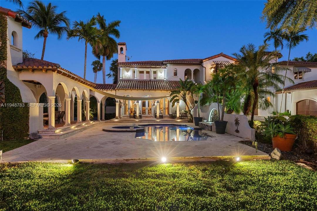 Stunning Spanish Villa, a rare opportunity to enjoy the exclusive, guard gated Hammock Oaks community, featuring double slips and a 75 boat dock with water and electric, offering direct ocean ...