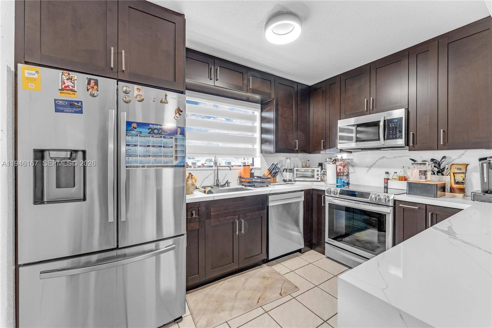 Beautifully upgraded Camelot townhome featuring 3 bedrooms and 2 remodeled en suite baths upstairs, plus a discreet guest bath downstairs and two comfortable living areas.