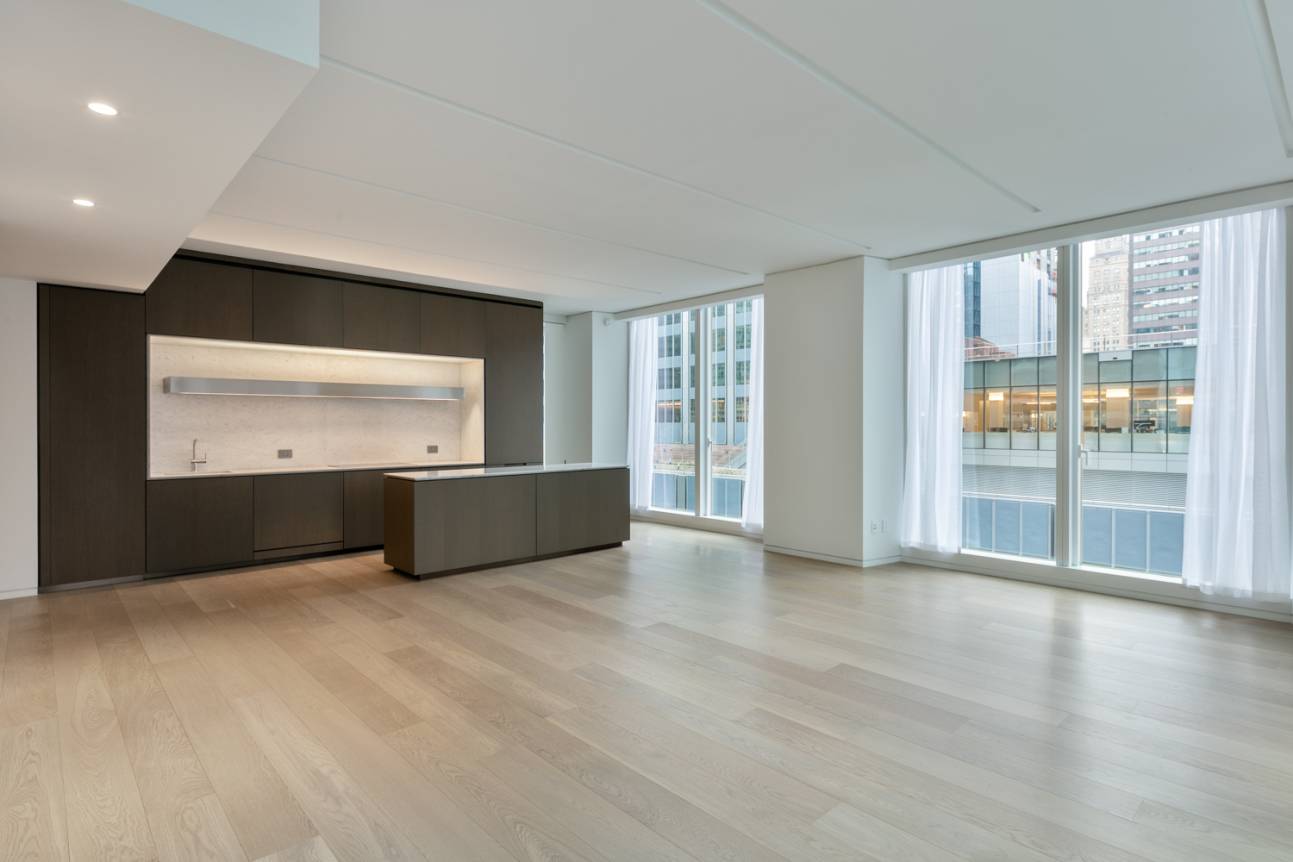 An elegant oak entry door welcomes you to this gracious 1, 970 SF two bedroom, two and a half bath residence situated in the tower of One Hundred East Fifty ...