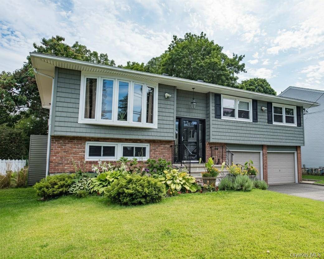 Tastefully updated 4 bedroom, 2 full bath hi ranch, emphasizing all major upgrades.