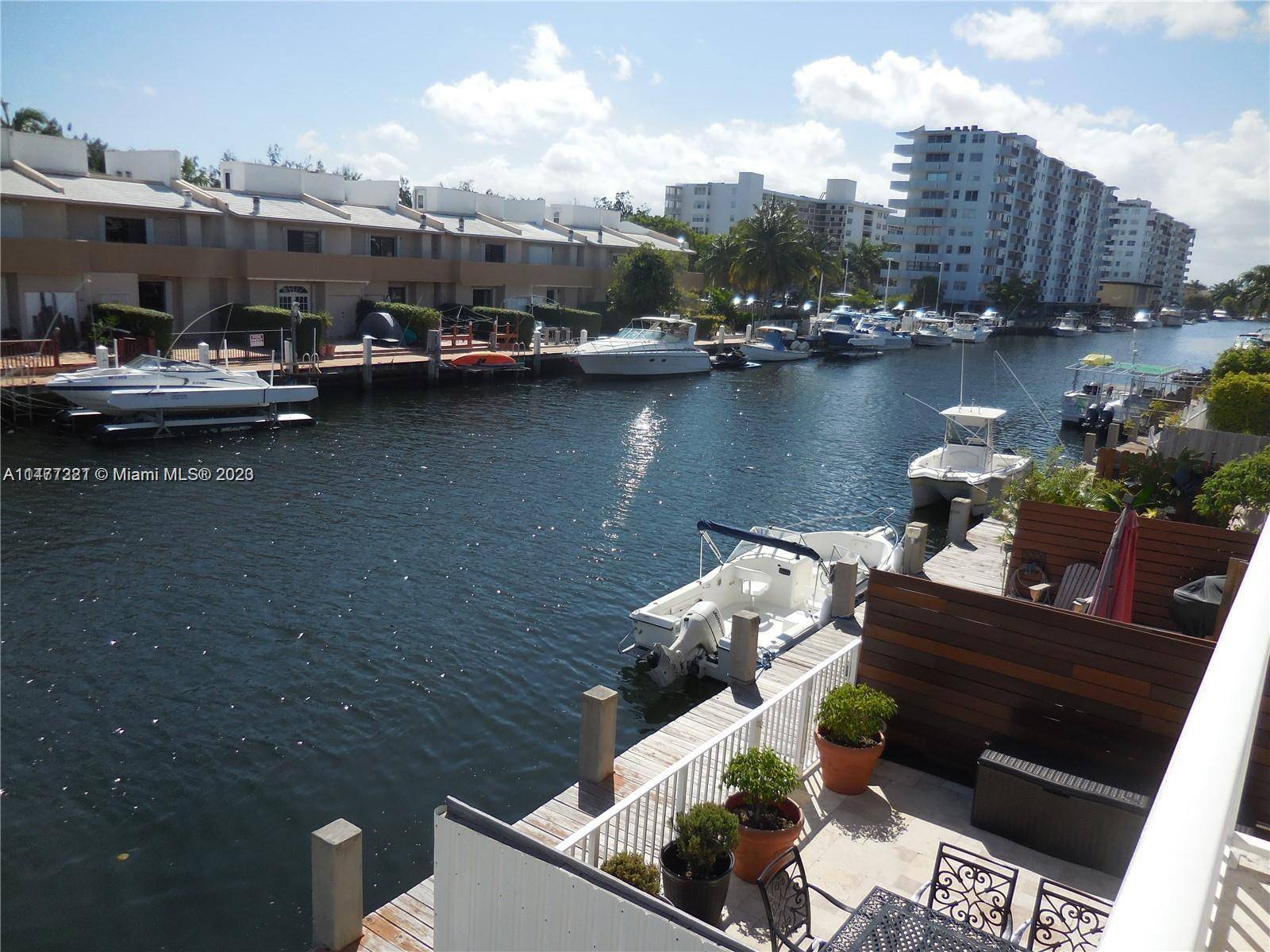 FULLY FURNISHED two story 3 3 townhouse on the water in Eastern Shores comes with its own private dock.