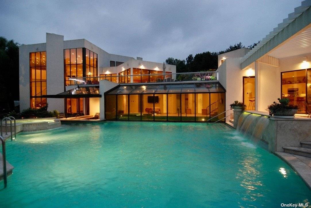 This beautiful masterpiece boasts 10, 014 square feet of ultra luxury living, plus a finished basement and an oversized garage that can accommodate up to 8 cars.
