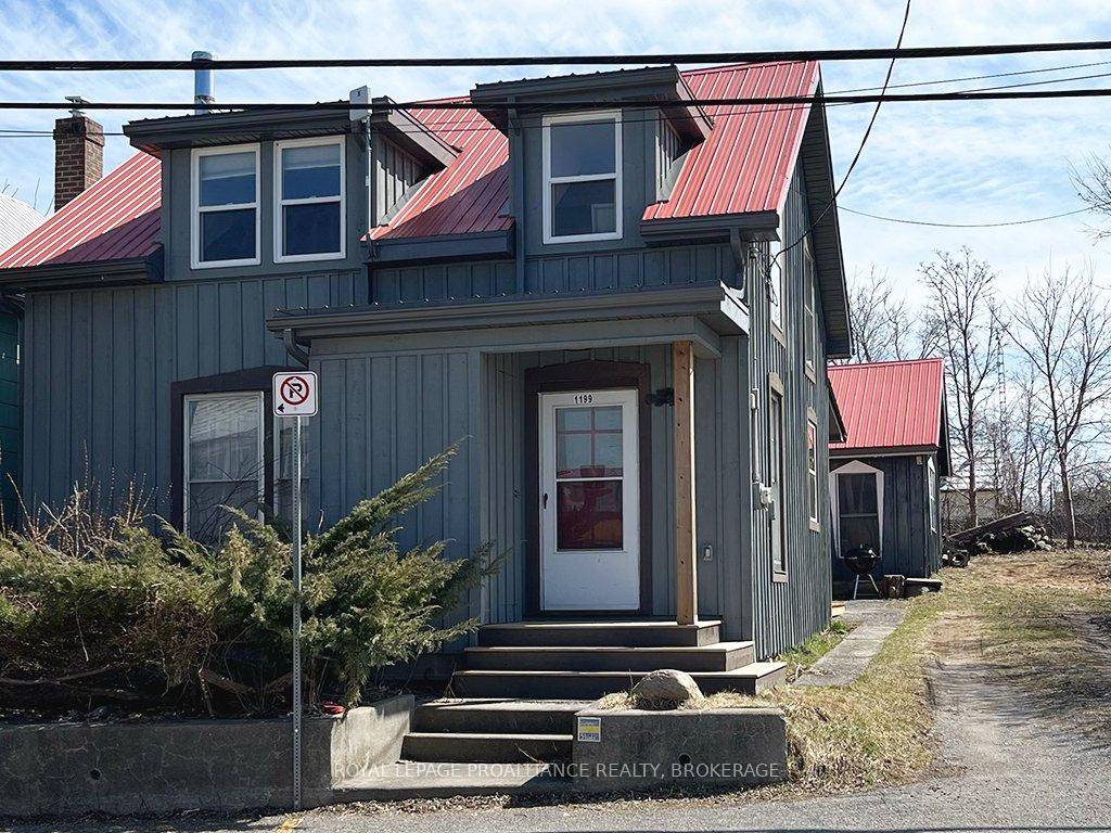 Located in the heart of Marysville, Wolfe Island, you'll find this charming, character filled, year round home.