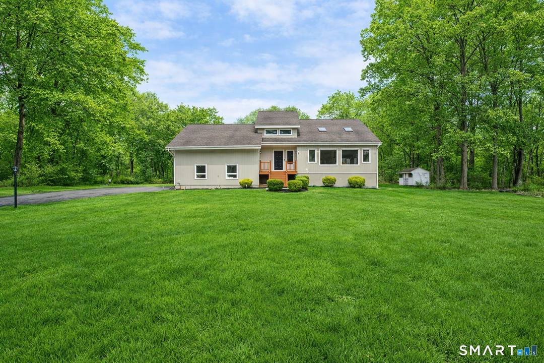 Set on a private, tree lined lot, this 4 bedroom, 2.