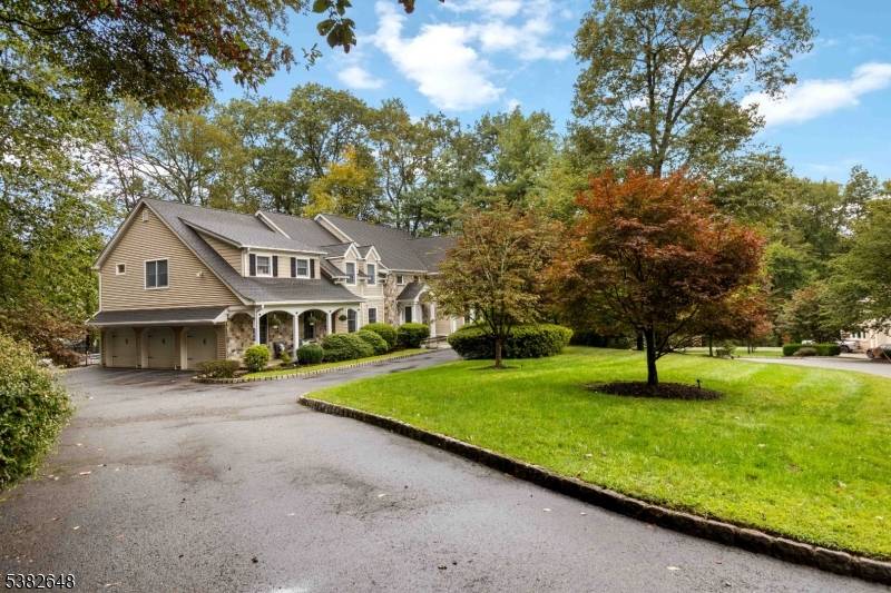 Country Charm Meets Modern Elegance Stunning Ctr Hall Colonial w timeless stone beige siding feels like a decorator's showhouse blending refined updates w modern comfort.