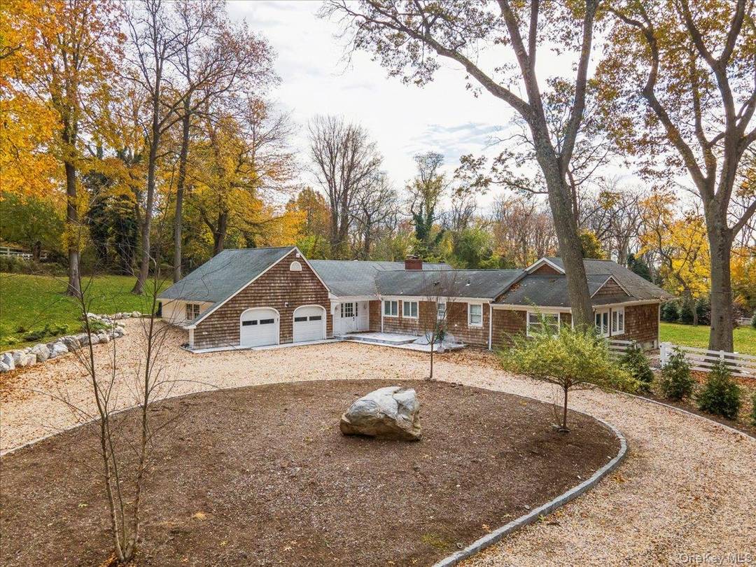 Experience true coastal elegance in this exceptional 4BR, 3BA sprawling ranch, perfectly situated on 2 lush, private acres.