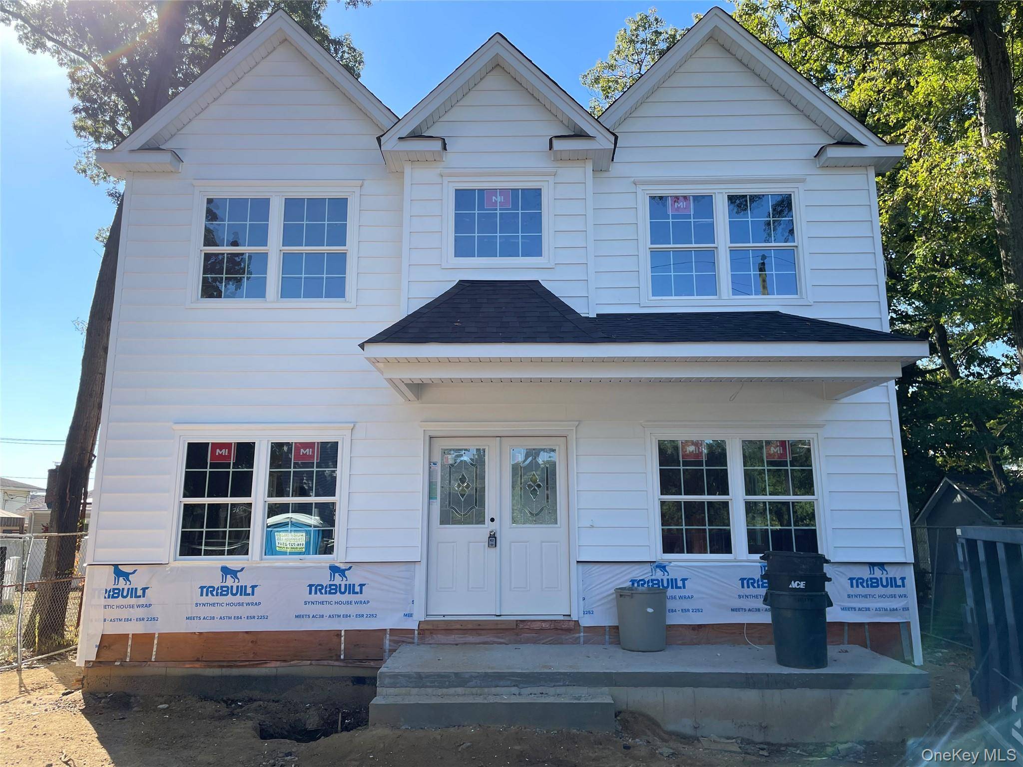 New Construction ! Center Hall Colonial with a Covered Front Porch Stacked Stone Detail and Slate flooring.