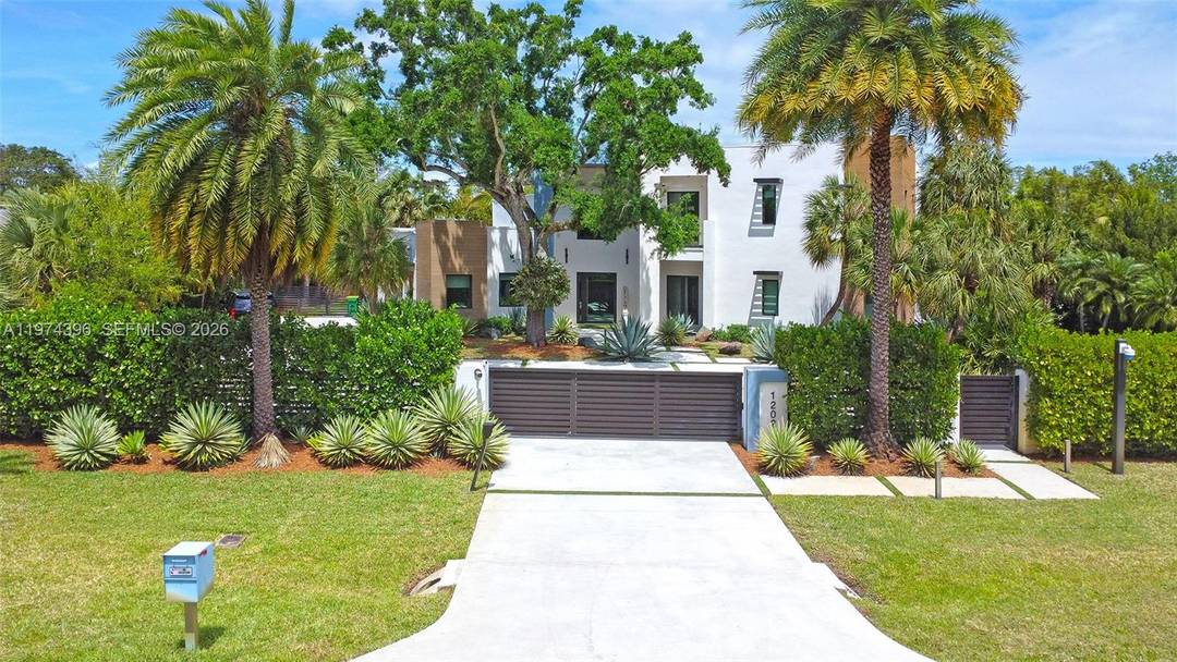 Welcome to a stunning Modern Transitional estate, fully remodeled in 2020, located in the prestigious Plantation Acres community.