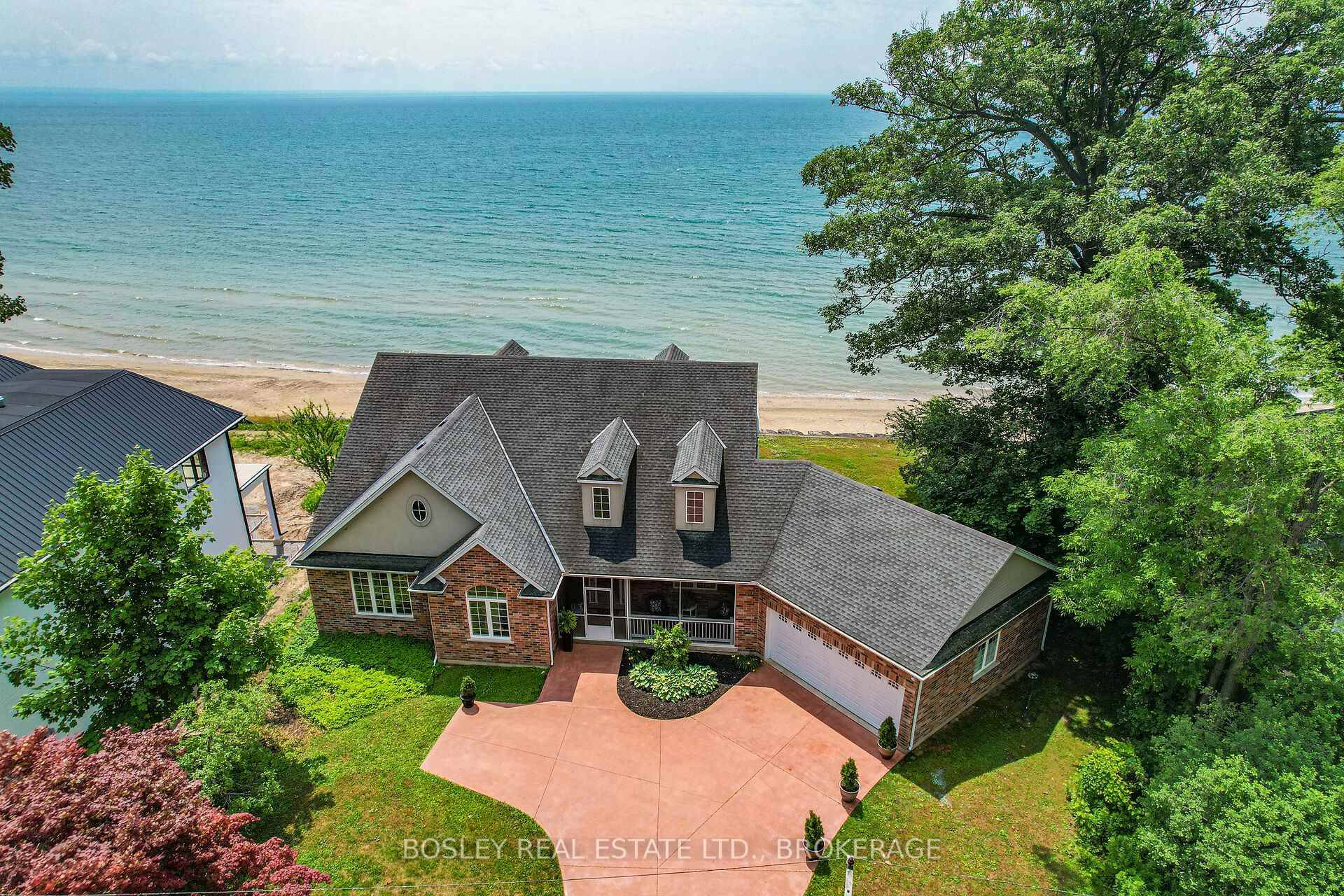 This gorgeous, 2, 126 square foot brick bungalow is situated on a huge private lot with 100 feet of your own private white sand beach a rare find and an ...