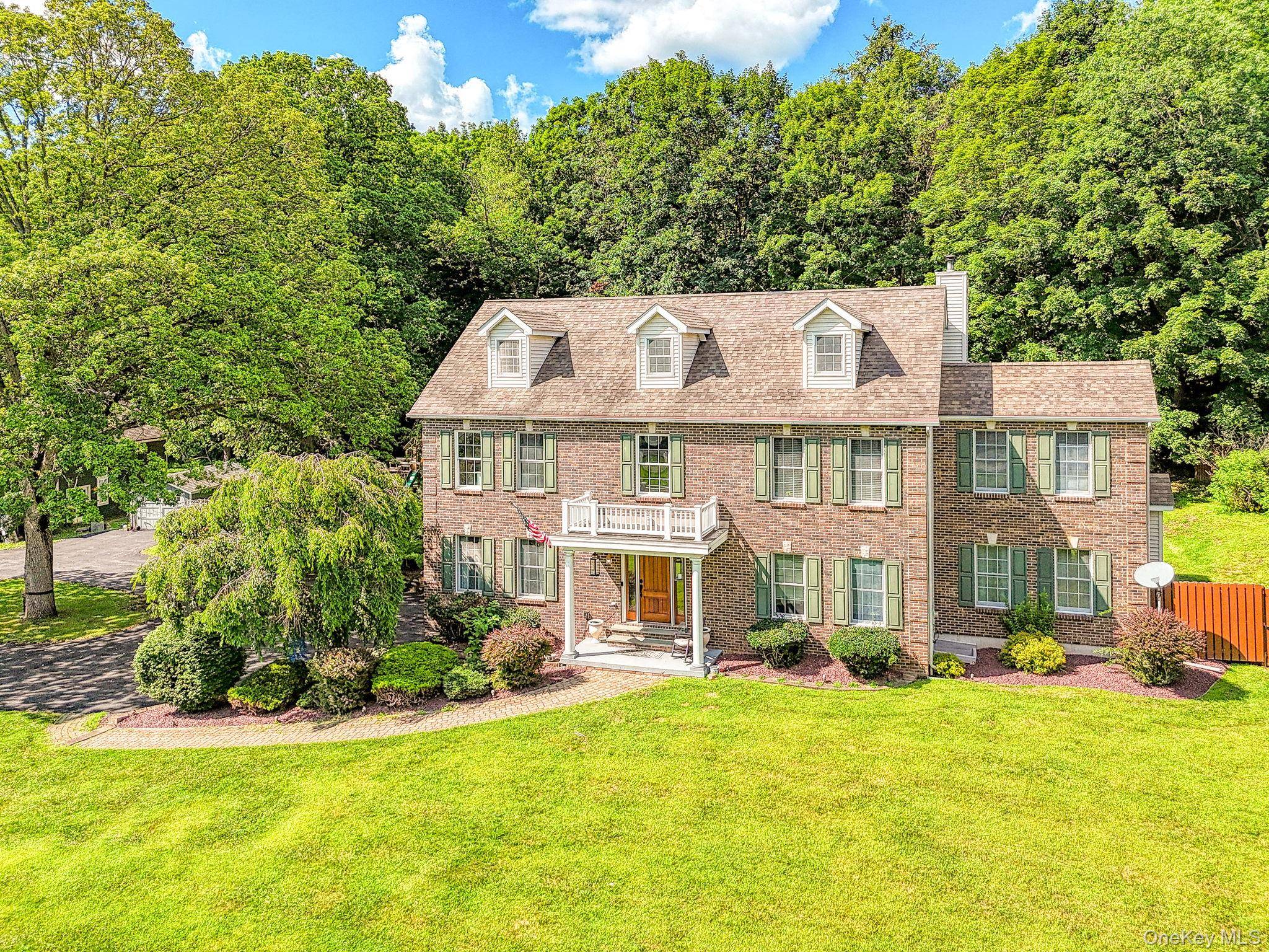 EMBARK ON YOUR DREAMS Expansive Custom Colonial with Dream Garage, In Ground Pool, award winning Cornwall Central School District and just one hour to NYC.