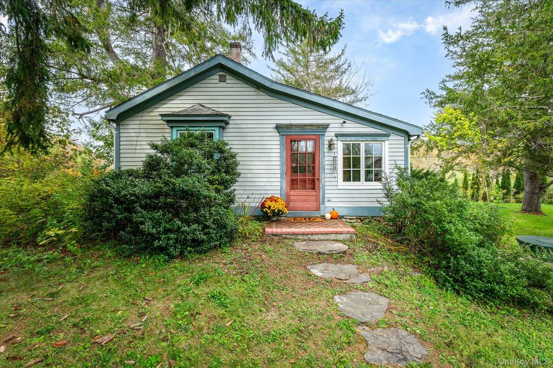 A rare two building property, 1 Hoyt Road pairs a classic farmhouse with a newer studio style structure built in 2008, featuring a fireplace, full bath, and two car garage.