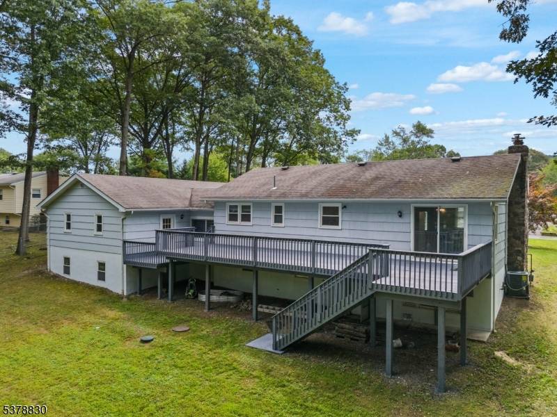 Welcome to this beautifully updated ranch with scenic views backing to Carib Pond.