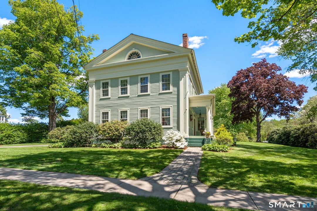 Premier location ! Beautiful Greek Revival Colonial located on historic main street in Suffield.