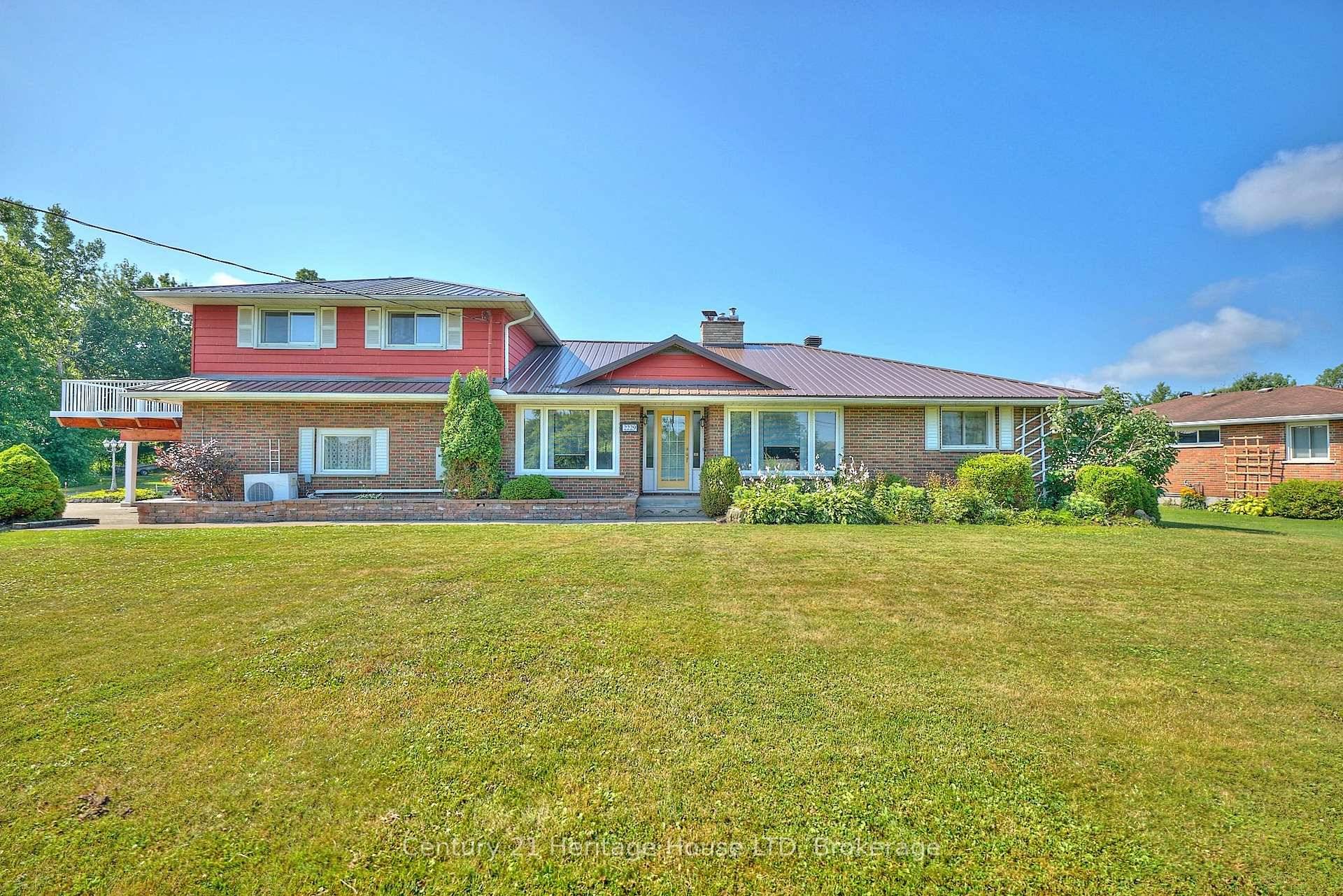 Spacious 1. 5 Storey Home on Nearly 5 Acres with a generous sized In Law Suite.