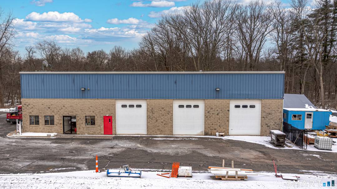 79 W Dudley Town Road, Bloomfield, CT offers a versatile commercial lease combining office and industrial space.