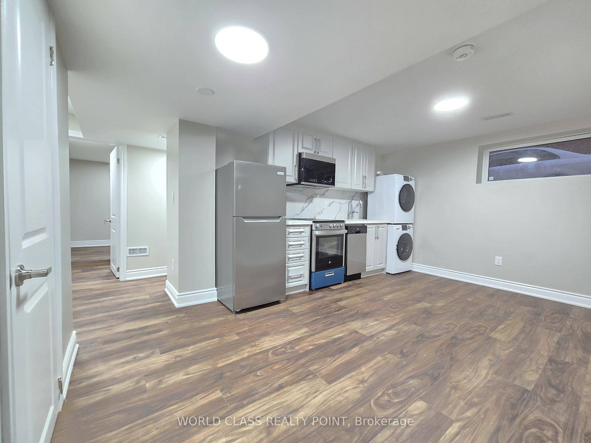 New, Elegant and legal, architect designed 1 Bedroom Den apartment has an open concept design.