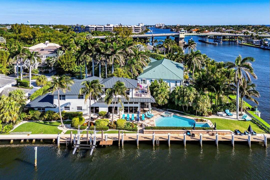 Welcome to your private tropical oasis on a prime corner lot.