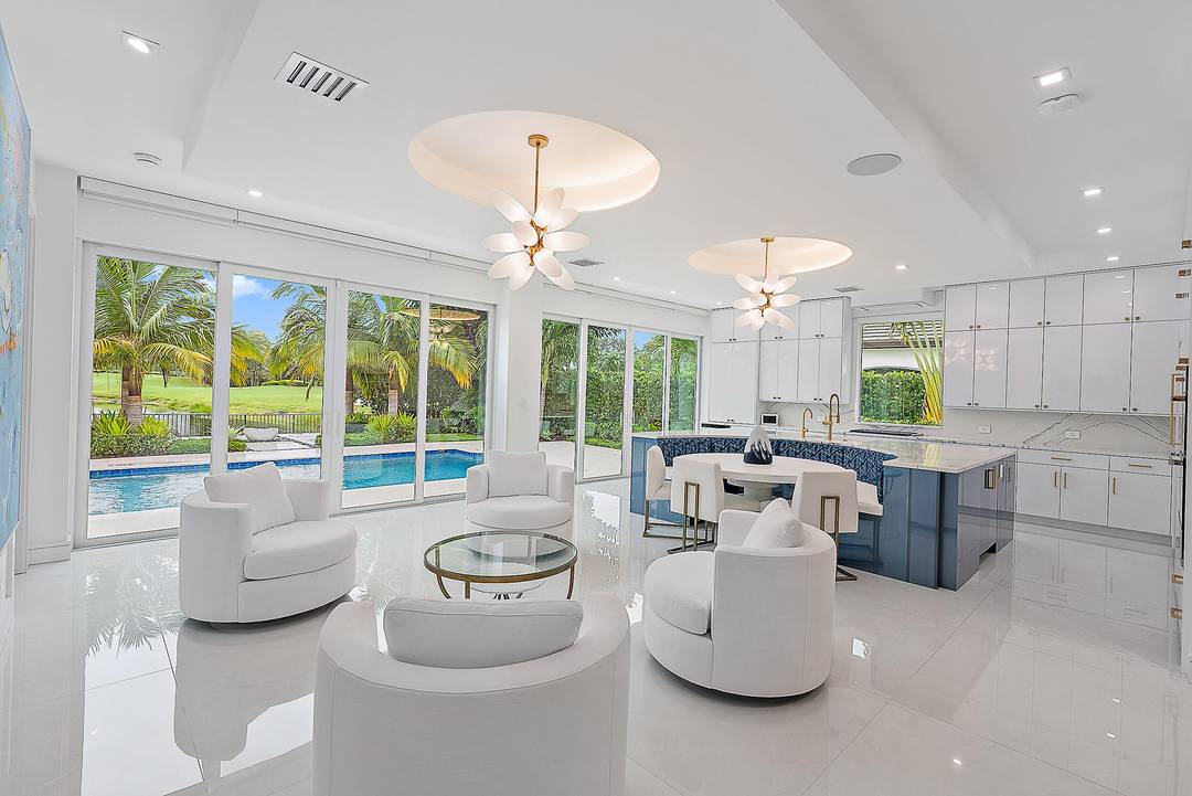 Welcome to this spectacularly reimagined residence in the exclusive Admirals Cove community where impeccable craftsmanship, modern luxury, and serene water and golf course views converge.