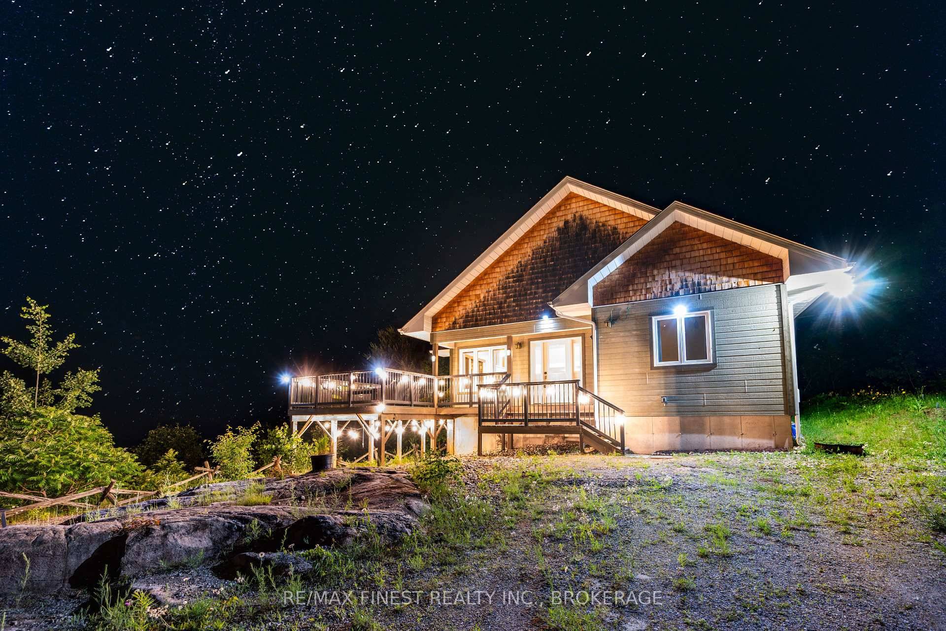 Welcome to 2092 Beach Road a stunning, year round waterfront retreat on the shores of pristine Shawenegog Lake.