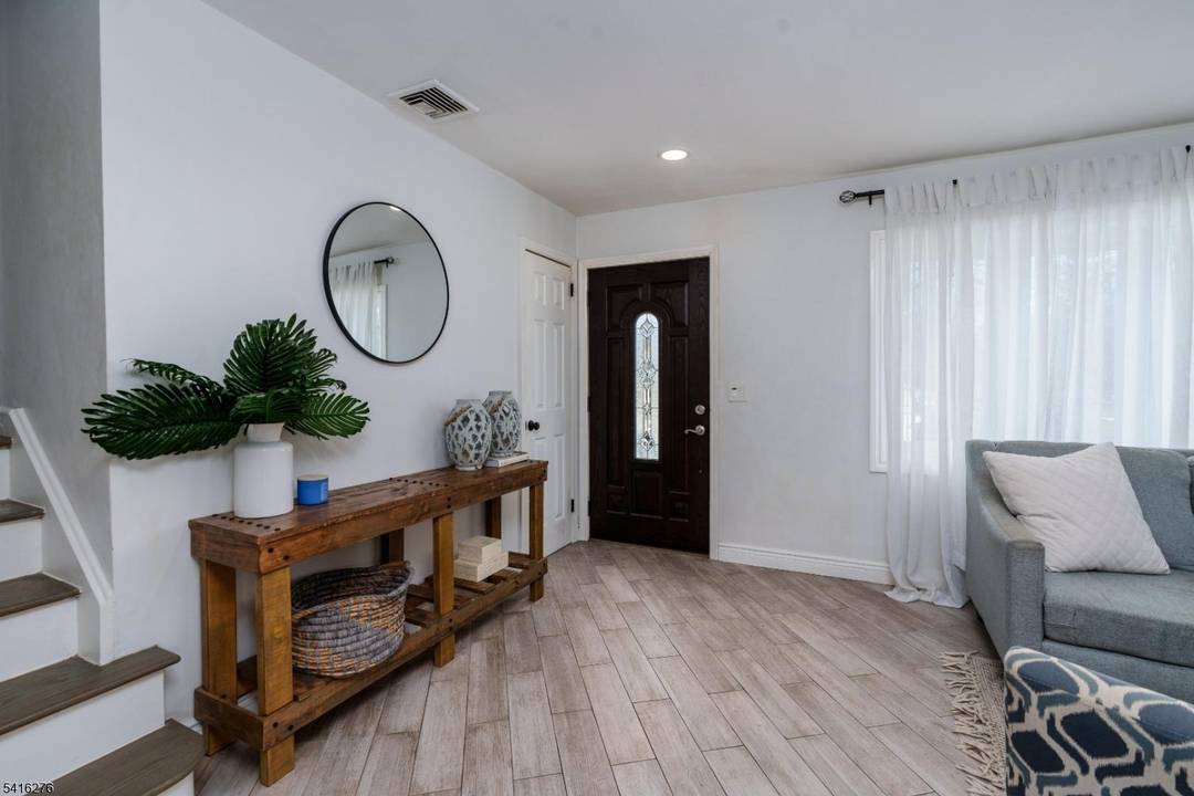 Step into this beautifully maintained split level home and imagine starting your day with a cup of coffee while sunlight fills the inviting living spaces.