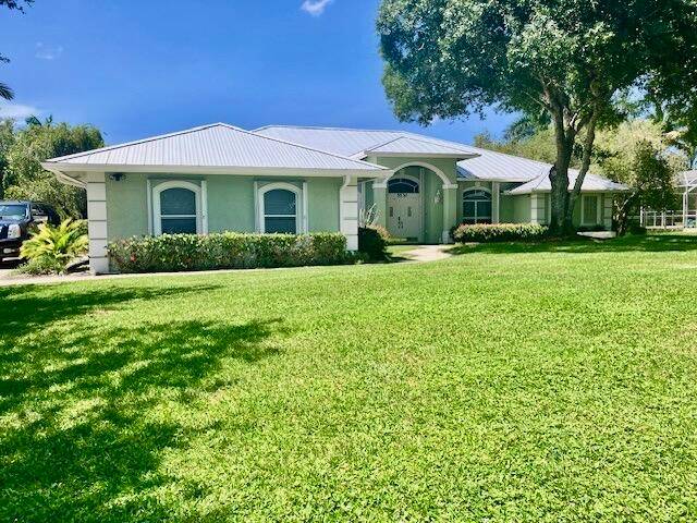 Beautiful lake front oasis situated on an half acre plus property.