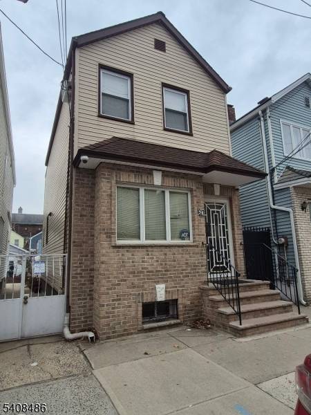 Welcome to this charming, renovated brick Colonial nestled in the highly sought after Ironbound section of Newark.