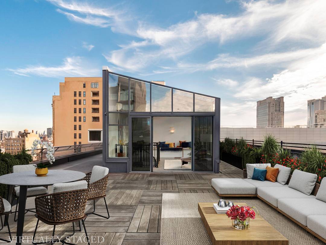 This stunning one of a kind prewar penthouse has been meticulously renovated down to the studs, seamlessly blending enchanting turn of the century detail with modern luxury.