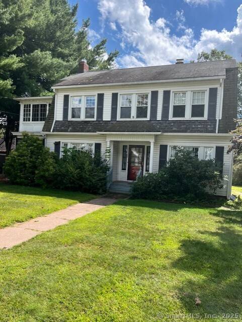 Charming well maintained classic colonial set on lovely landscaped lot.