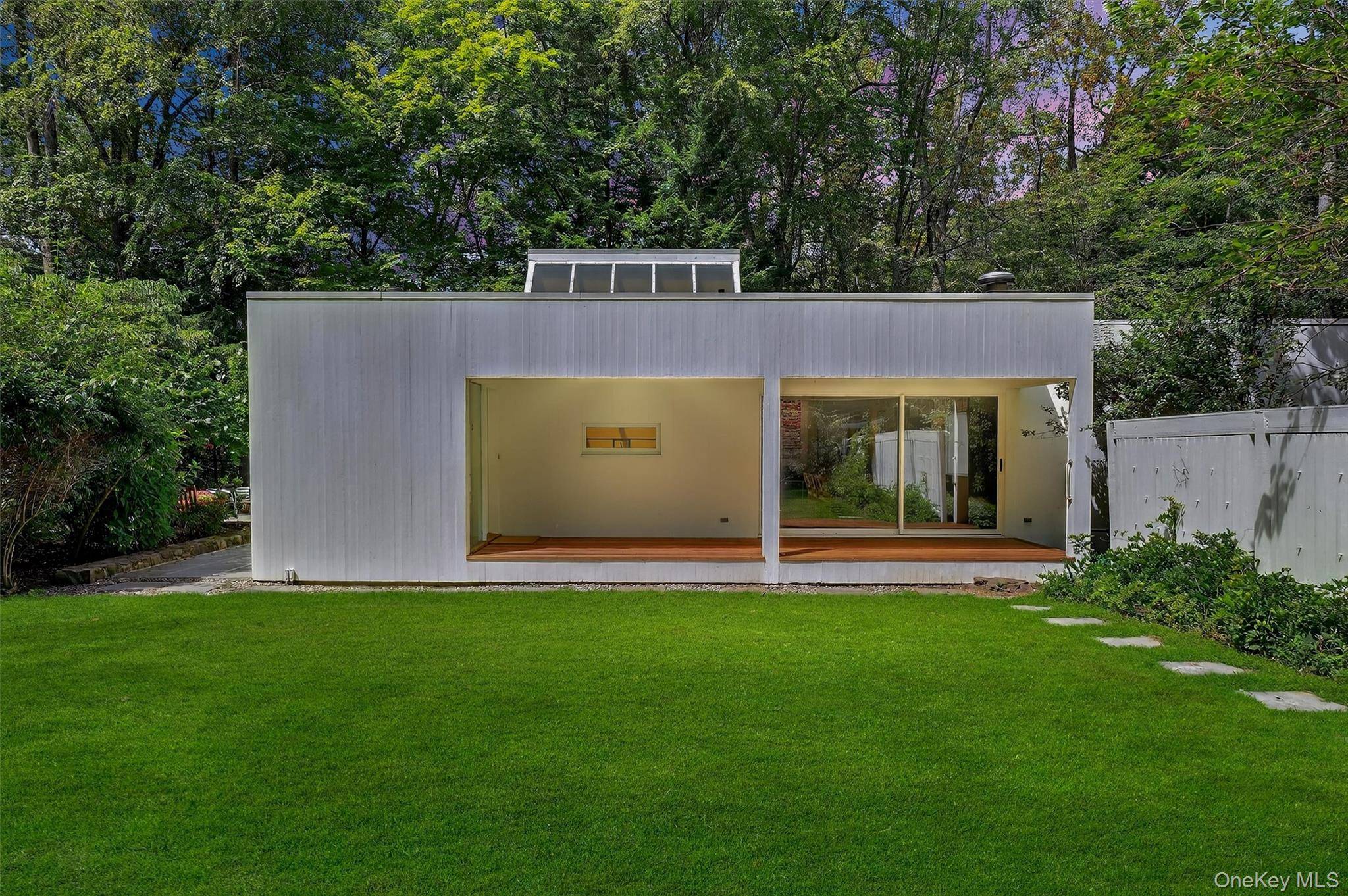 Dramatic modern architecture meets serene privacy in this one of a kind residence designed by architect John Schiff.