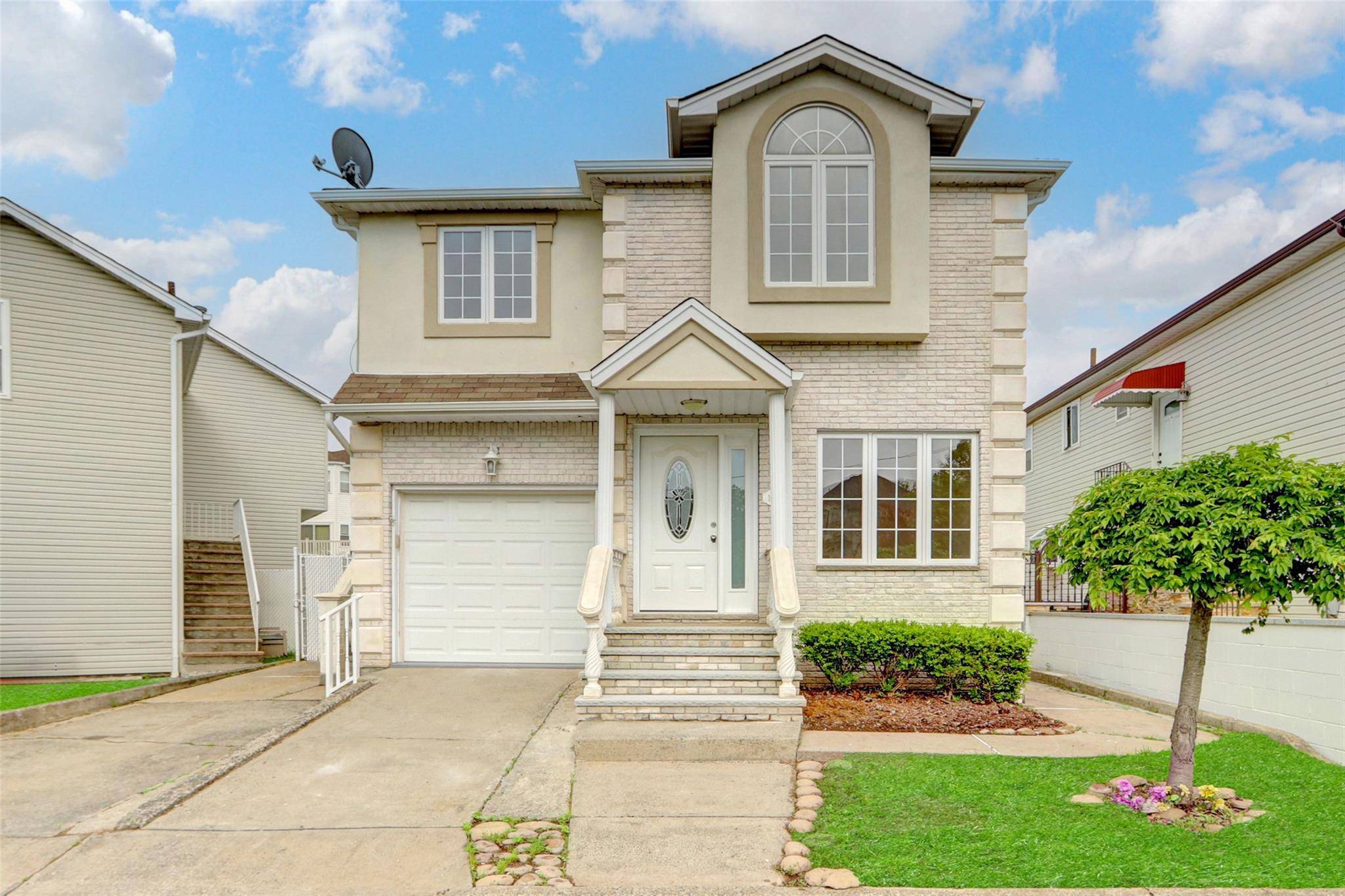 Updated and gorgeous free standing 2 Family residence in the beautiful Pleasant Plains section of Staten Island, having exceptional hardwood flooring, beautiful brick fireplace, spacious and open layout, recessed lighting, ...