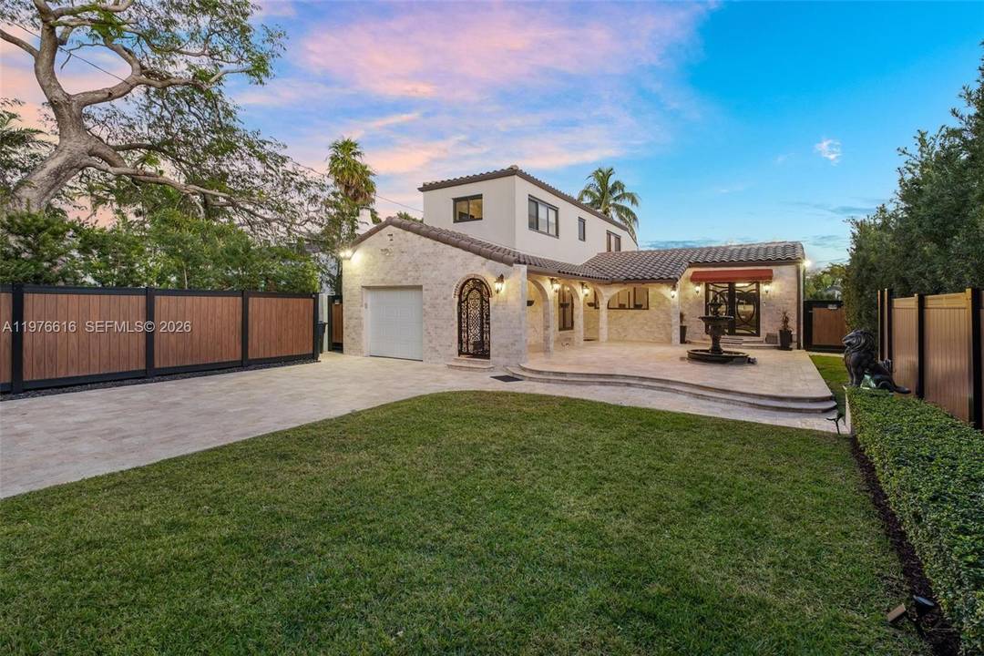 Beautifully renovated turnkey home on prestigious Alton Rd offering privacy on a sprawling 9, 200 SF lot.