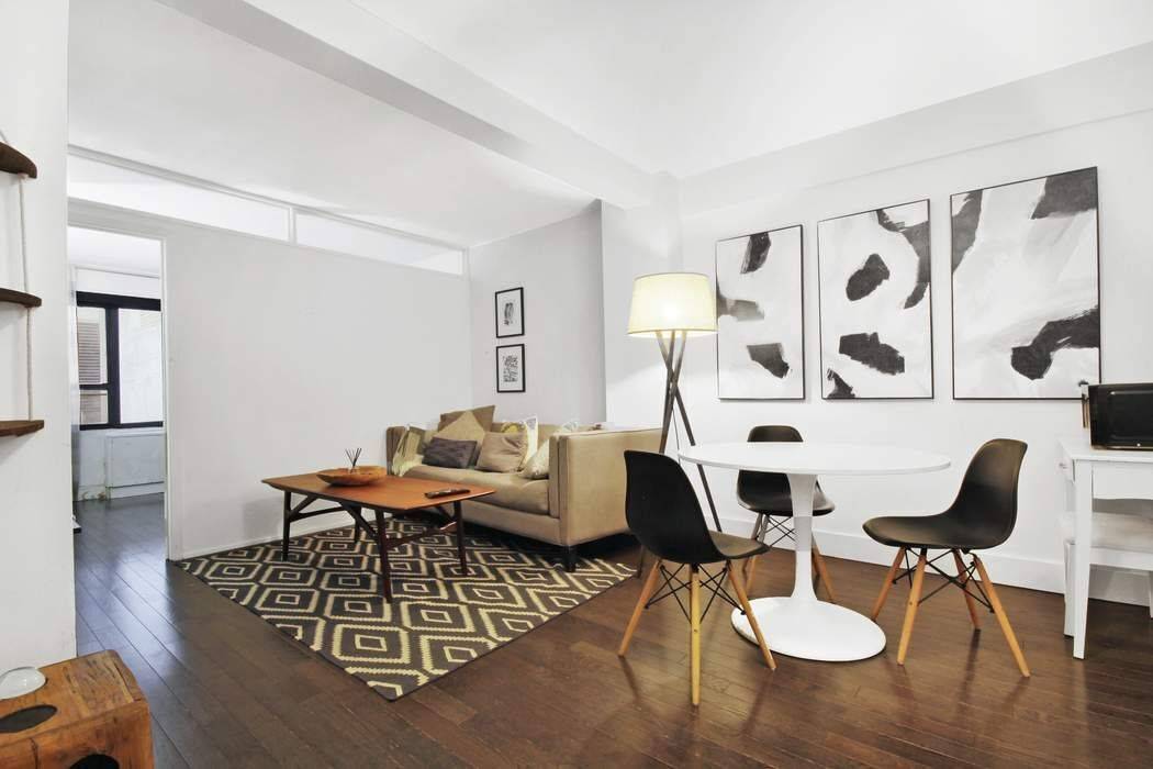 Spacious designer semi furnished 2 BR apartment features mahogany stained hardwood floors and modern and stylish furniture and decor.
