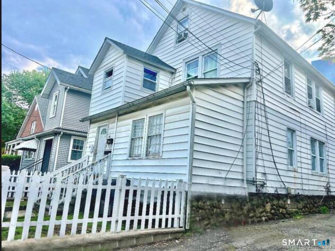 Spacious, heart of Stamford 2 Family with great potential.