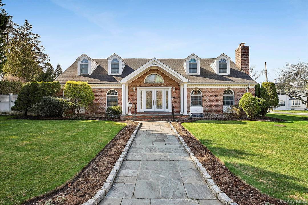 Nestled in the highly coveted Douglaston Manor, This architecturally distinguished home sits on an expansive corner lot, Just one block from the water.