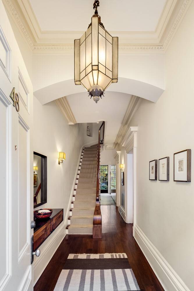 Exceptional and Wide Single Family Townhouse in the West Village Built in 1846, this sun filled grand scale 22.