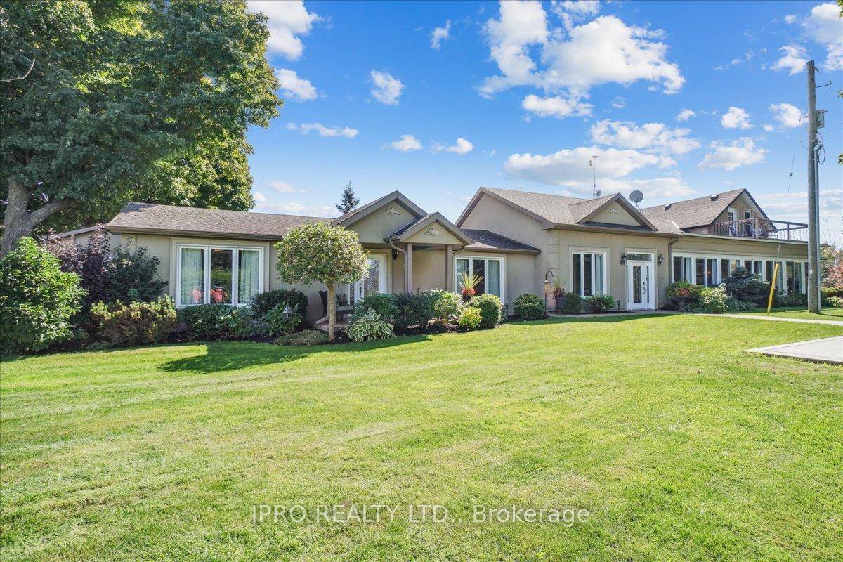 This Exceptional property offers a stunning 5 br home with an in law suite, two kitchens, two living rooms, a great room, and two laundry rooms.