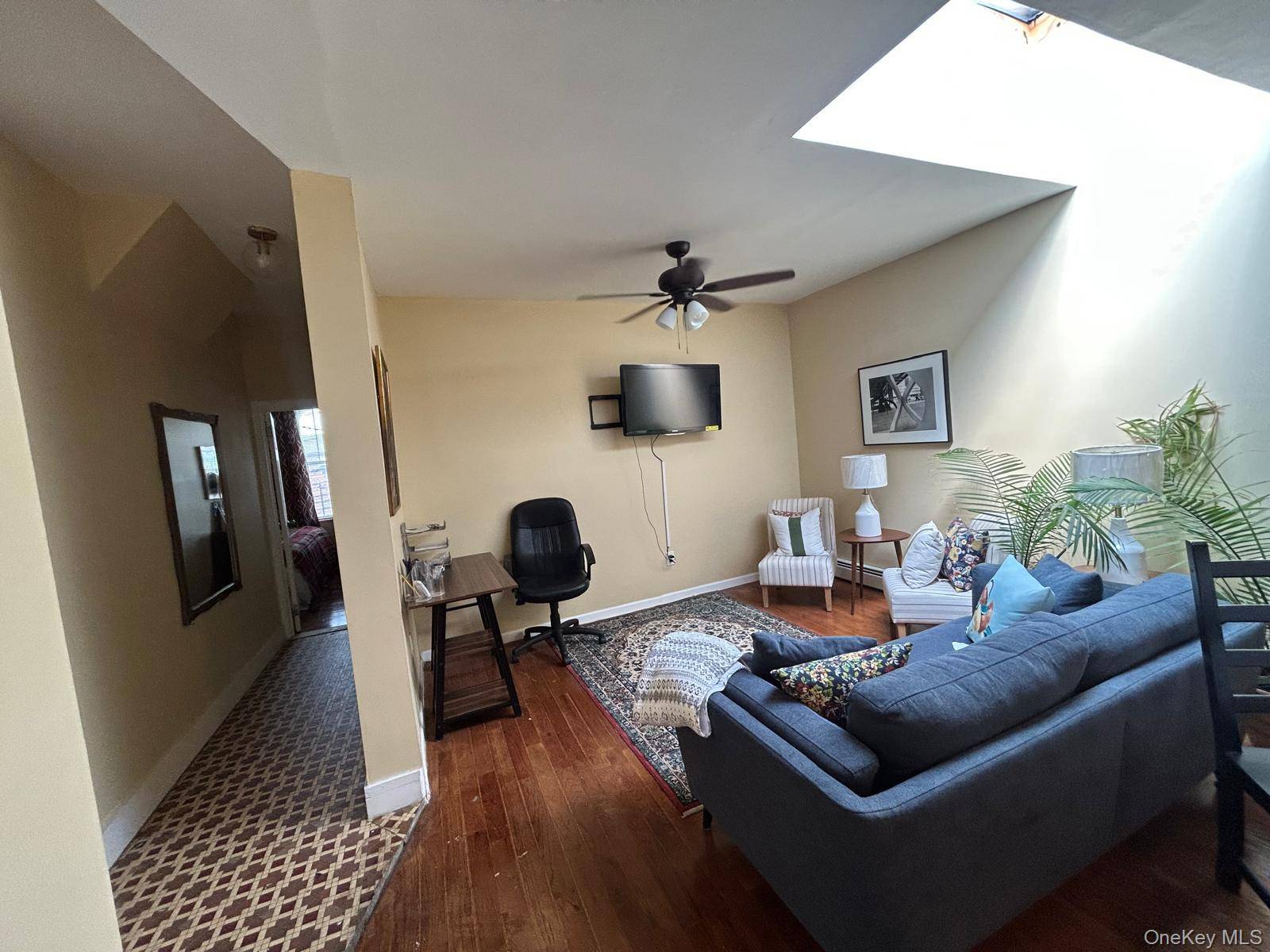 This second floor apartment offers three bedrooms, one full bathroom, and an open concept living and dining area.