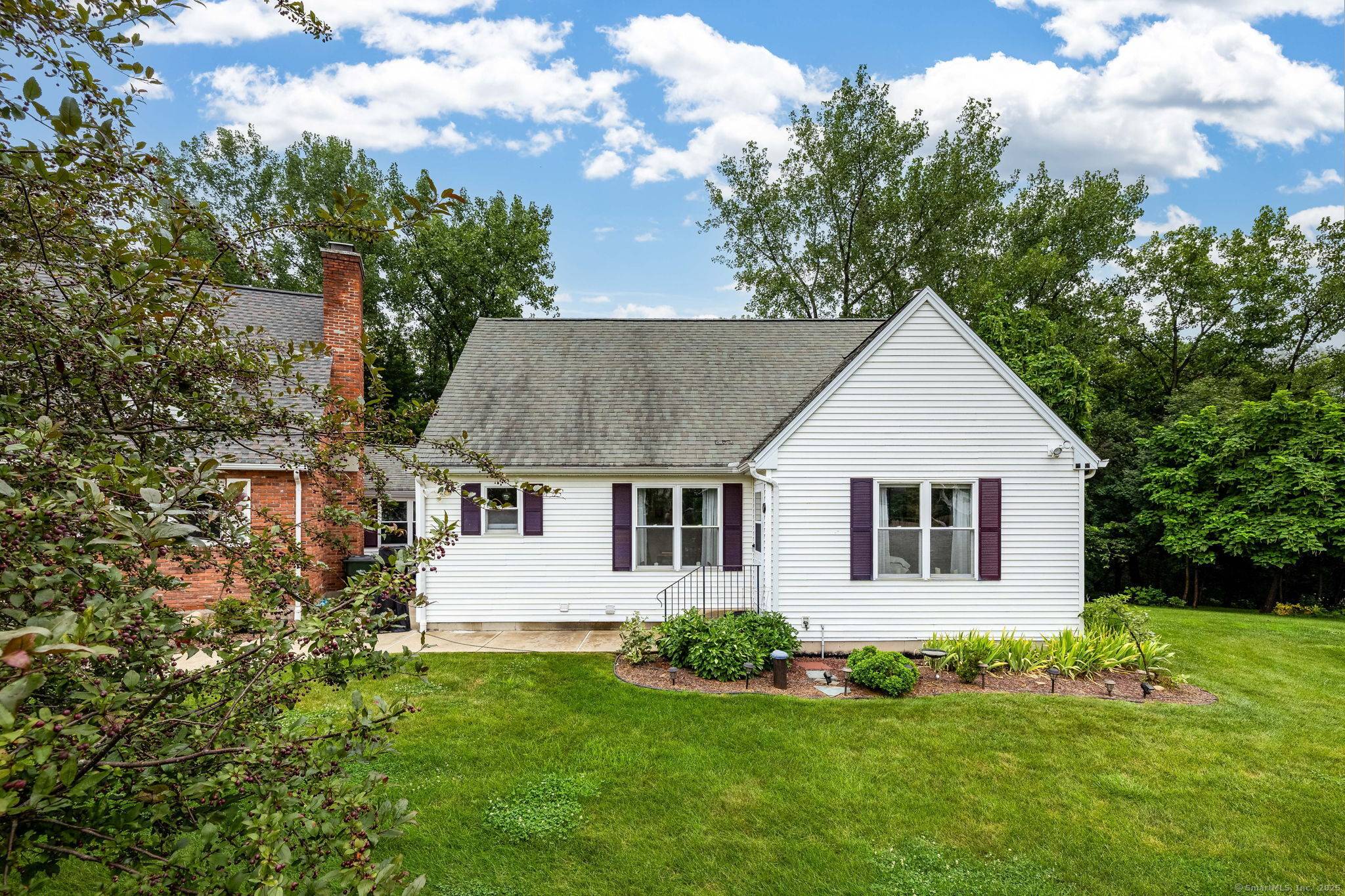 This is a very unique property in that it consists of 2 residential Cape style homes, connected by a terrific heated, finished living area.