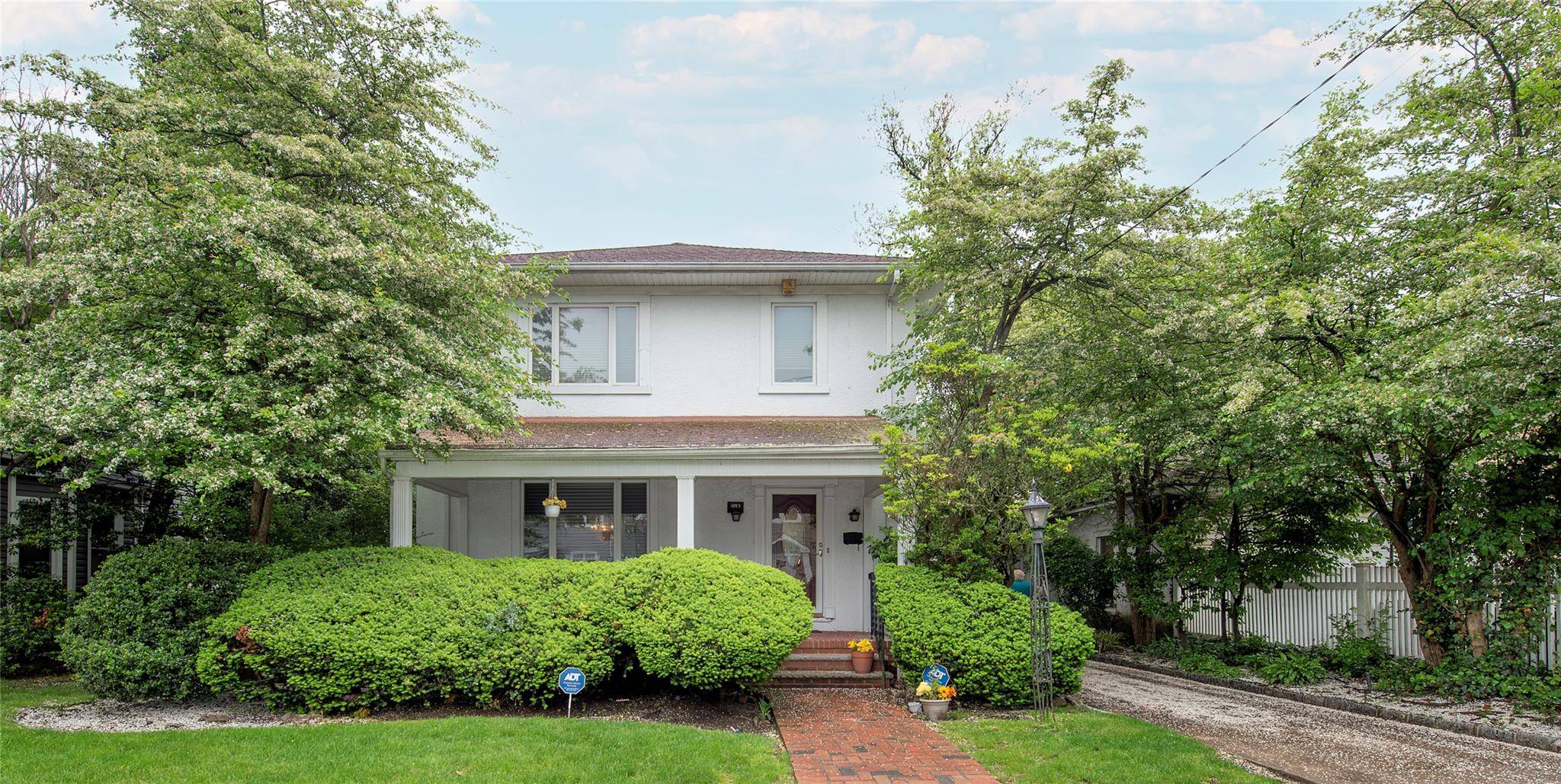 This Beautifully Maintained Home Is Situated On A Lovely Block In The Highly Desirable Woodmere Section of The Five Towns.