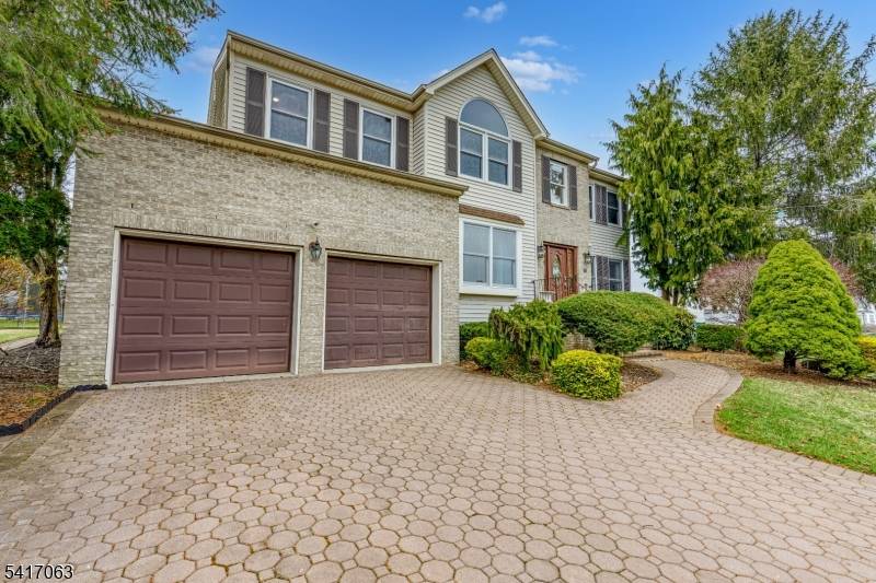 Well cared for Center Hall Colonial with many updates in desirable Brentwood Hills.