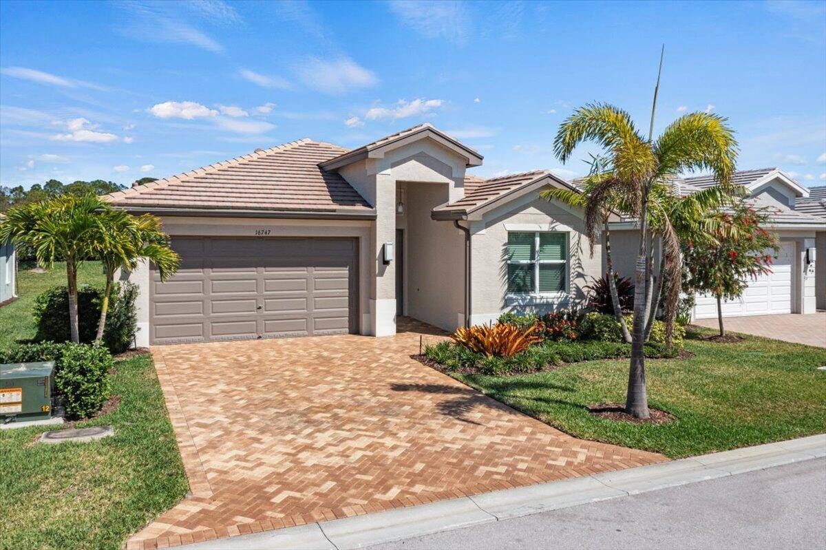 Stunning 2 bedroom plus Den 2 bathroom Barrel Roof Home located in the Resort Style Community of Valencia Grove at Riverland.
