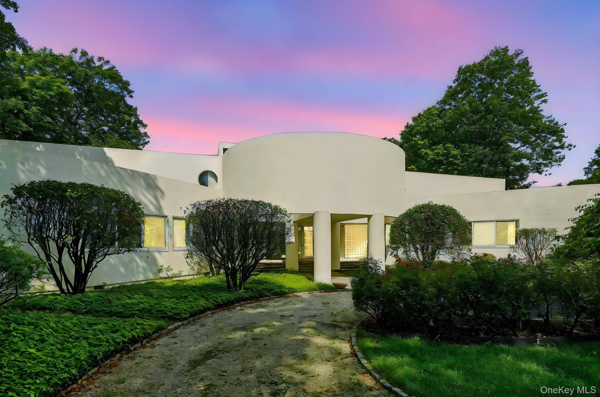 Nestled in breathtaking natural surroundings, this modern architectural masterpiece by renowned designer Myron Goldfinger offers three levels of striking contemporary design.