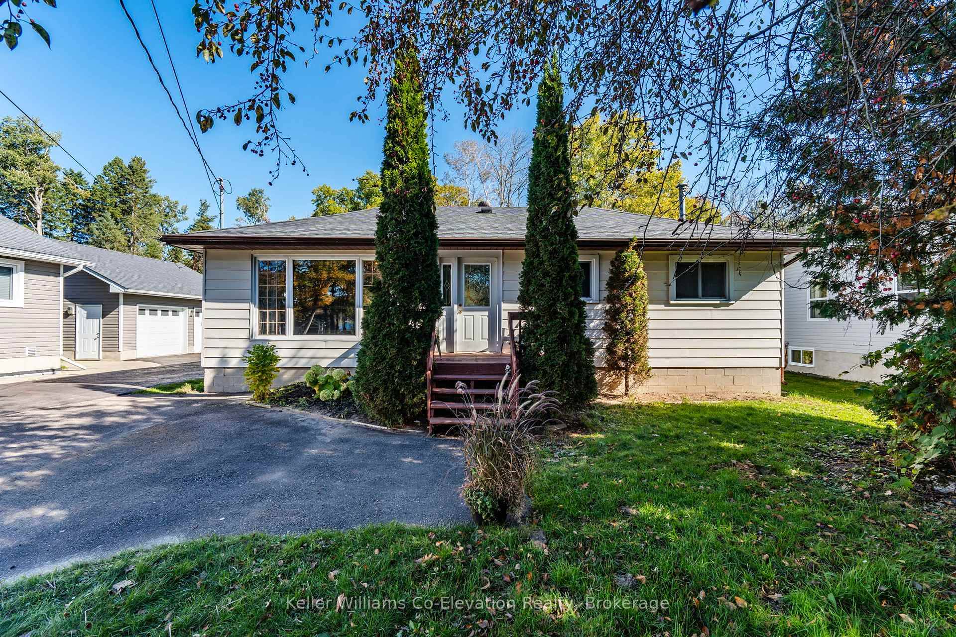 Hurry great opportunity to own a 3 bedroom, 2 bath home on a large lot across from a park with a playground and beach on beautiful Georgian Bay.