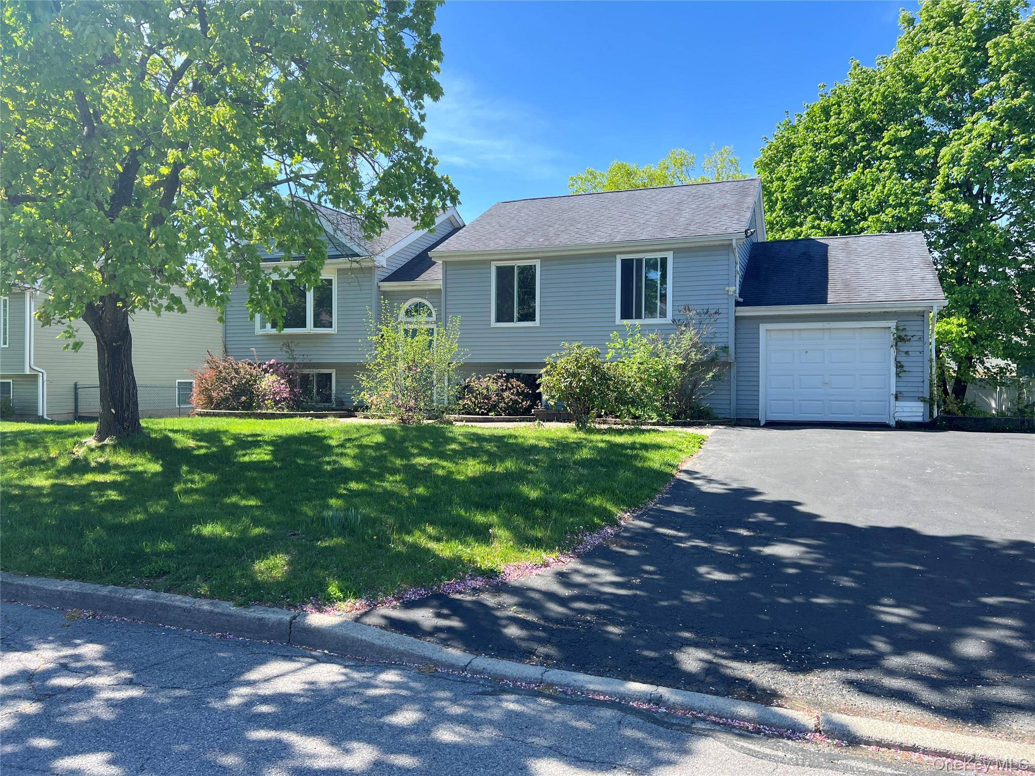 Welcome to 40 Iris Circle a beautifully updated raised ranch located in one of Beacon's most peaceful and discreet cul de sacs.