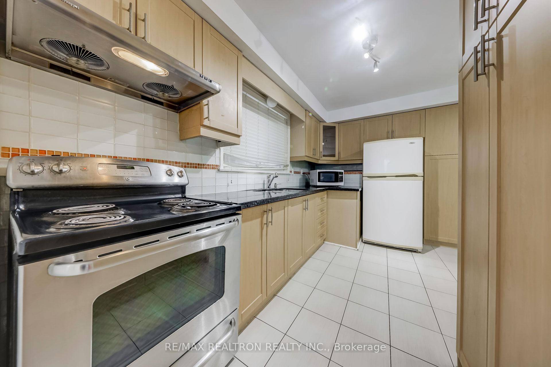 Upgraded Granite Top Kitchen with Newer Cabinets Gleaming Strip Hardwood Floors Cornice Mouldings, Bay Window Separate Entrance to Finished Basement with Its Own Kitchen, Bathroom, Rec Room amp ; 2 ...